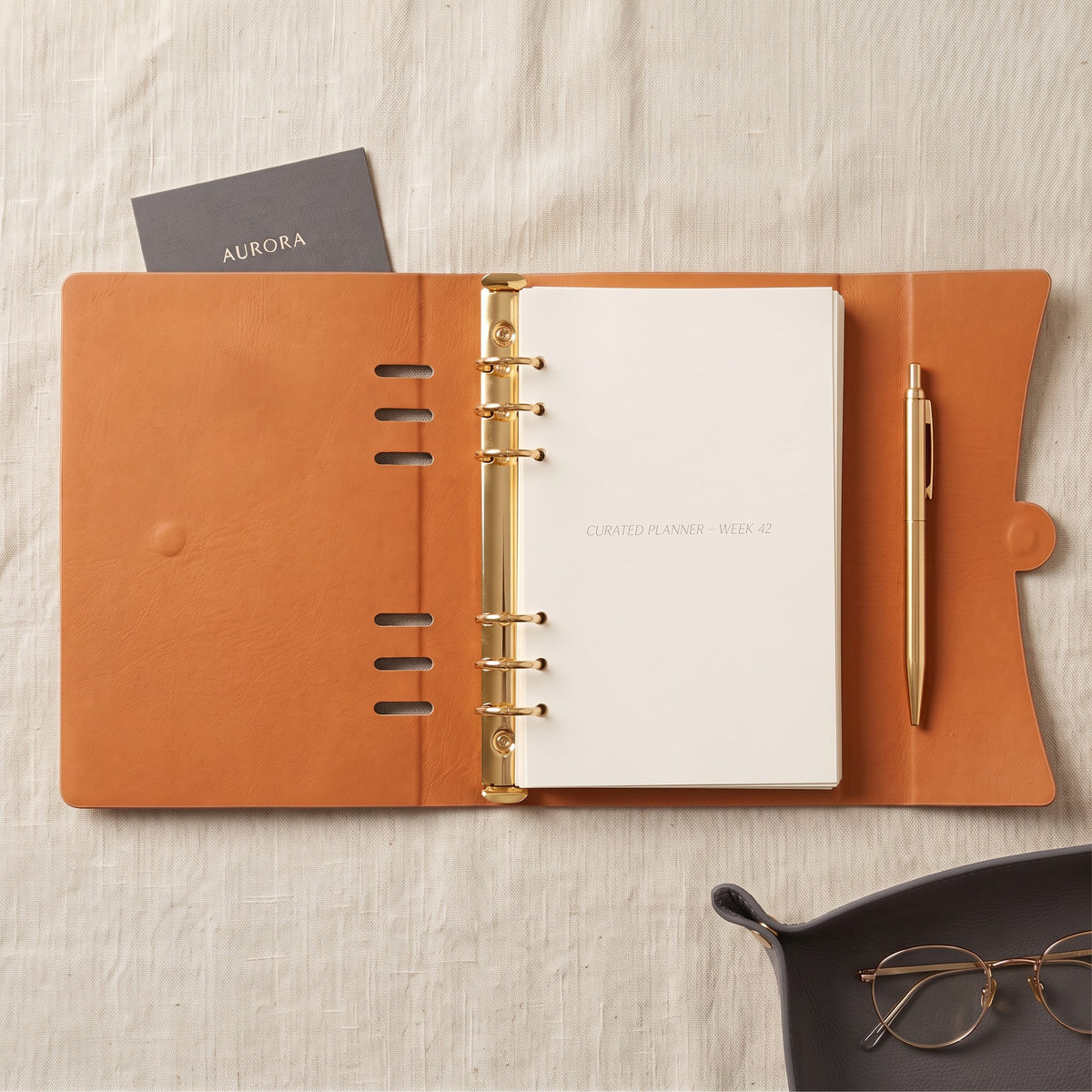 Open Champagne A5 planner binder showing the unlined interior and gold 20mm 6-ring mechanism